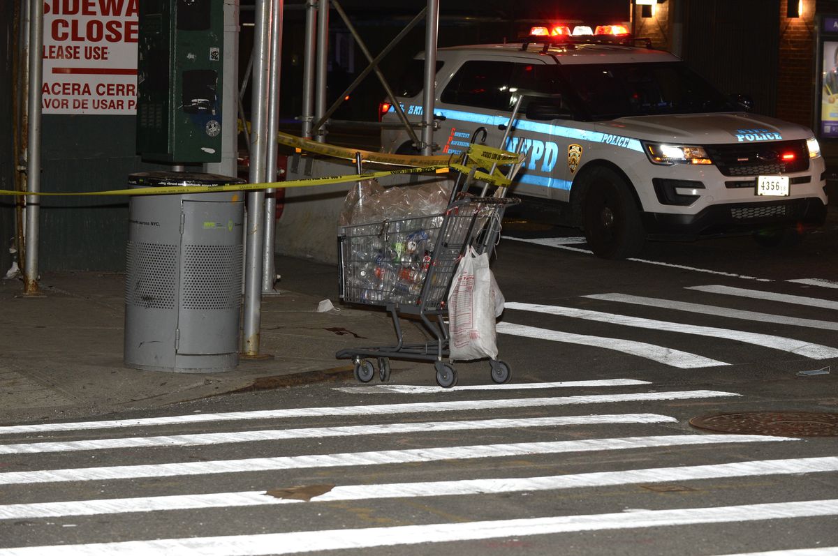 NYPD secure the scene on East 125 street and 3rd Ave. in Manhattan, where a man collecting cans was severely assaulted on Friday, April 23, 2021.